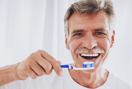 Man holding a toothbrush