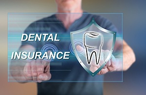 Man touching dental insurance on digital screen