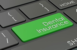 Green keyboard key that reads “Dental Insurance”