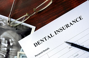 Paperwork for dental insurance coverage of tooth extractions in Lynchburg