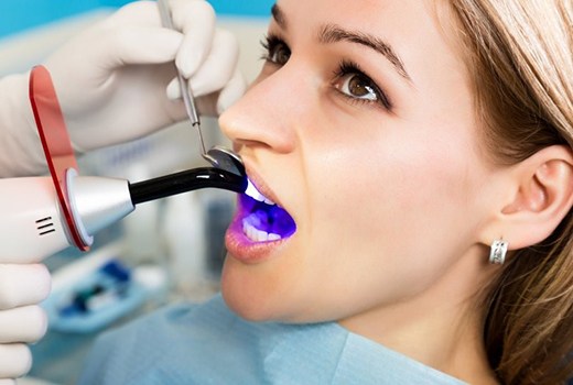 woman getting tooth-colored fillings in Lynchburg
