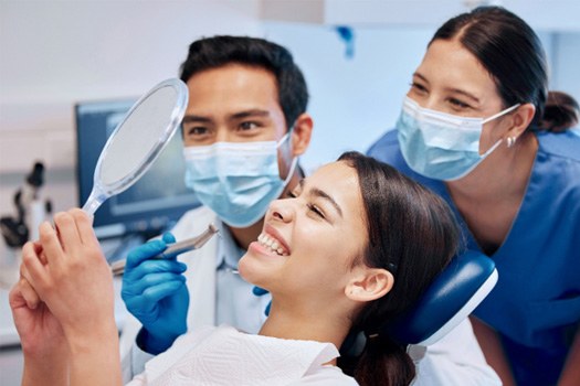 A woman getting a dental checkup and cleaning