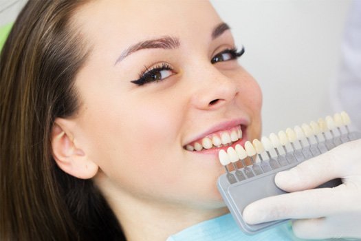 A woman getting cosmetic dentistry treatment