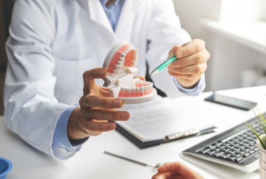 A dentist explaining dental implant post-op instructions in Lynchburg