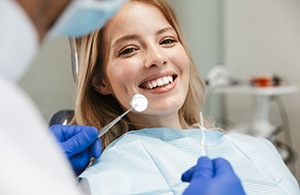 Woman smiling during dental checkup and cleaning