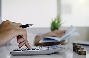 Man calculating cost of veneers in Lynchburg