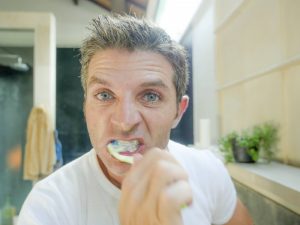 man brushing teeth too hard in lynchburg