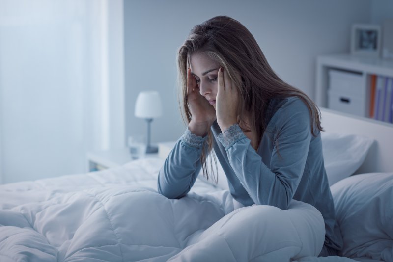 Woman awake with toothache