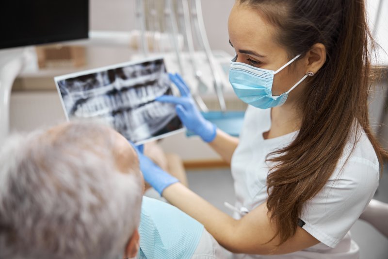 A dentist explaining the importance of jawbone density